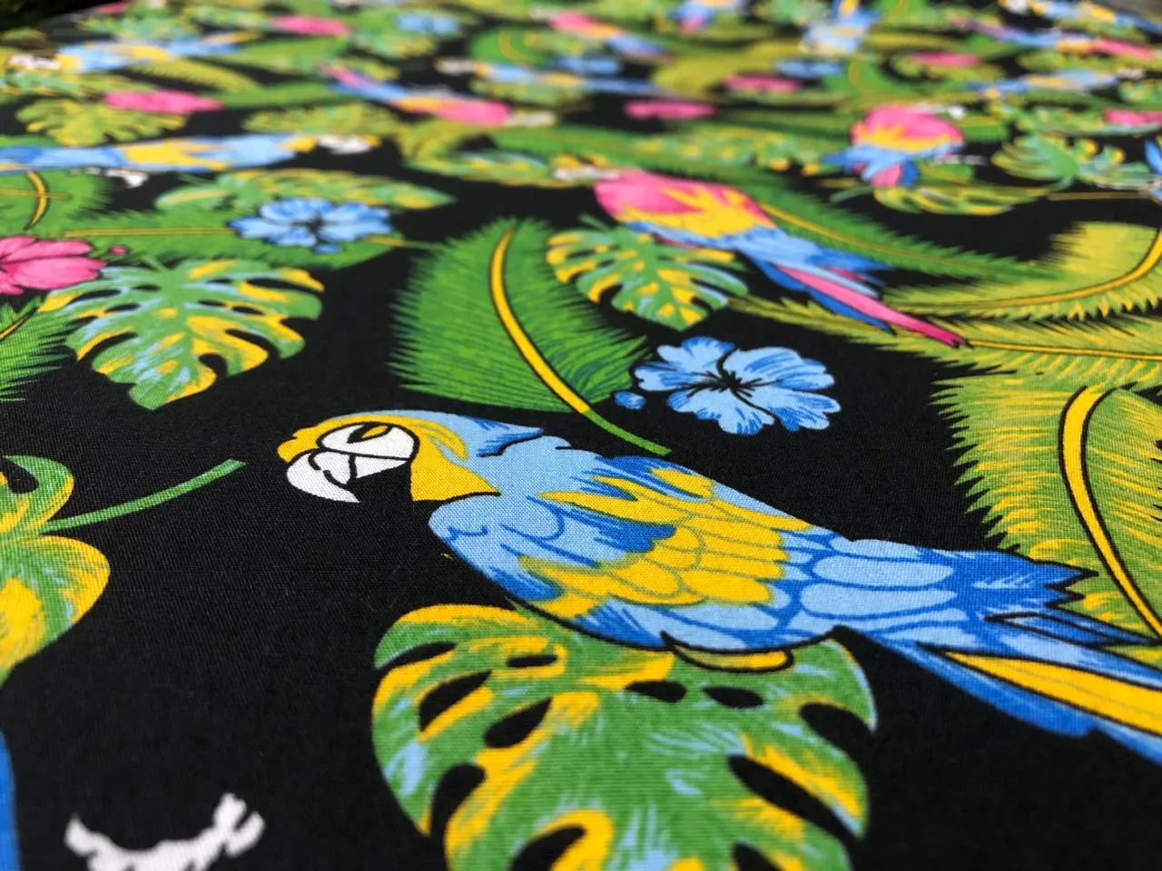 100% Cotton Poplin PRINT   58" wide RETRO BEACH available in 3 different prints pink ,orange, blue ,yellow ,green waves / black jungle with pink and blue parrots and flowers AND blue with lavender pink flowers