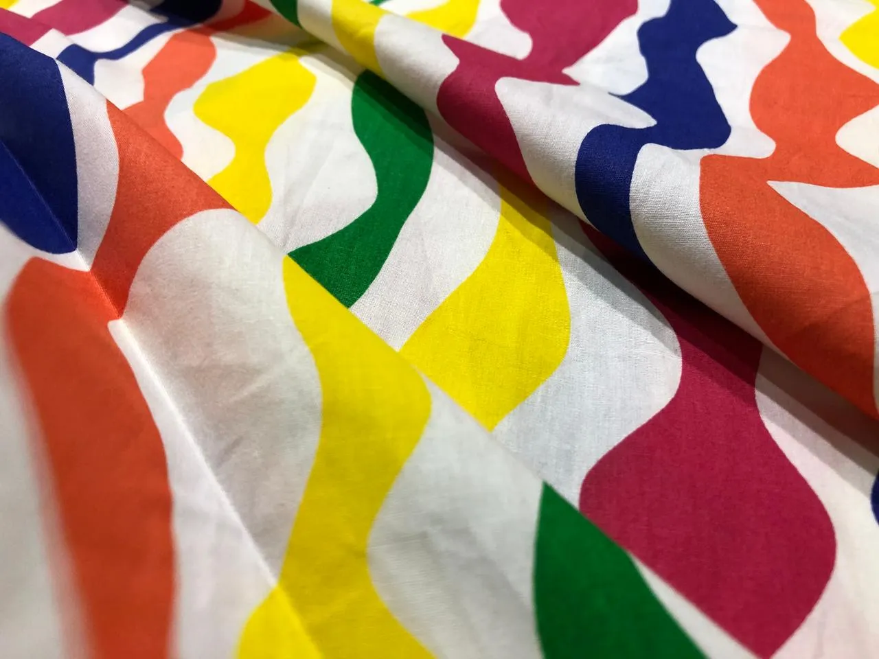 100% Cotton Poplin PRINT   58" wide RETRO BEACH available in 4 different prints pink ,orange, blue ,yellow ,green waves / black jungle with pink and blue parrots and flowers / blue with lavender pink flowers and black and white floral